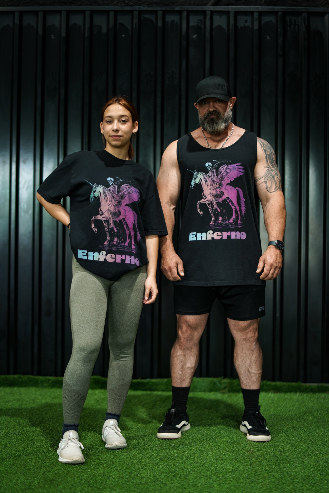 Enferno Death on a Rainbow Tee and Tank in Black on models Madelyn & Grady.